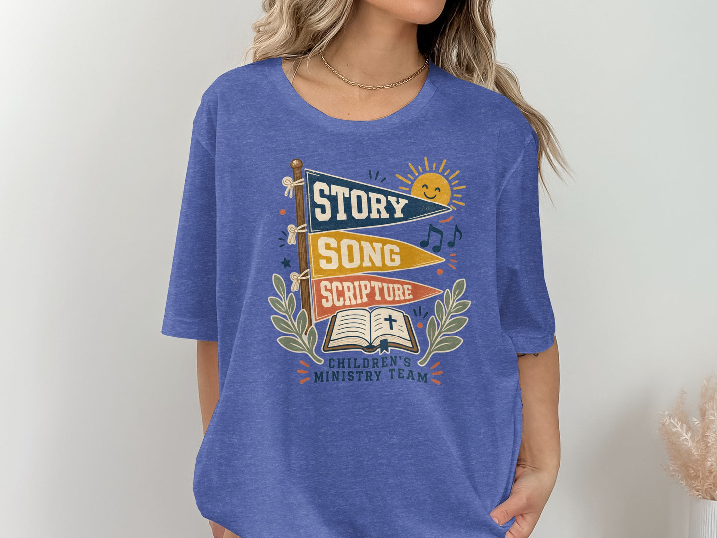 Blue t-shirt with "Story Song Scripture Children's Ministry Team" graphic.