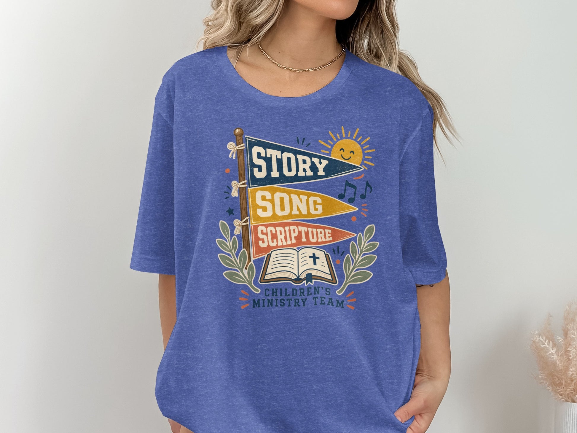 Blue t-shirt with "Story Song Scripture Children's Ministry Team" graphic.