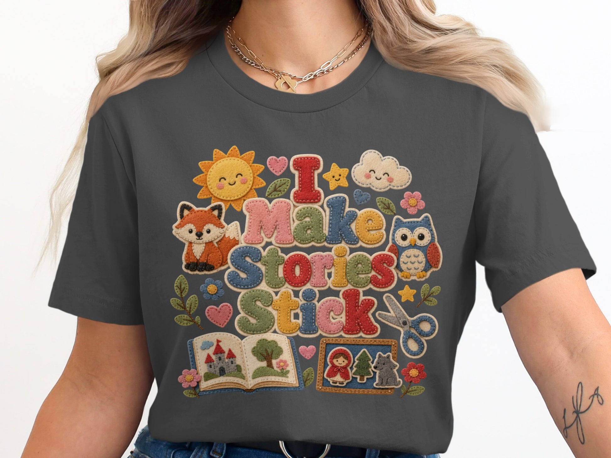 T-shirt with "I Make Stories Stick" and storybook elements.