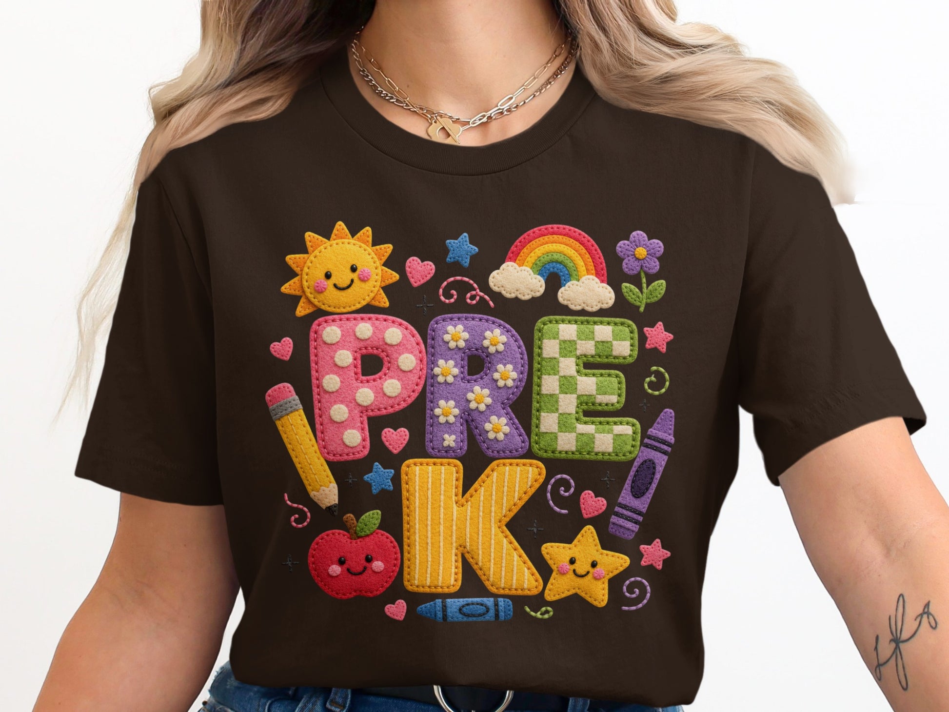 Brown t-shirt with "PRE K" in colorful, textured letters and school-themed graphics.