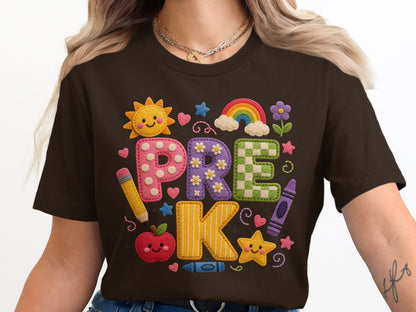 Brown t-shirt with "PRE K" in colorful, textured letters and school-themed graphics.