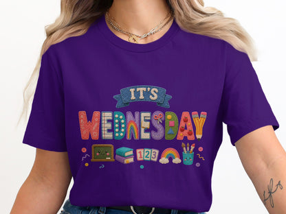 Purple t-shirt with felt-like text "IT'S WEDNESDAY" and school supplies.