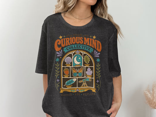 Dark grey t-shirt with "The Curious Mind Collective" graphic and window motif.