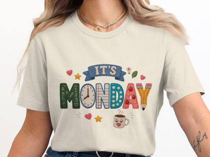 It's Monday text with school themed graphics, clock, and coffee mug.