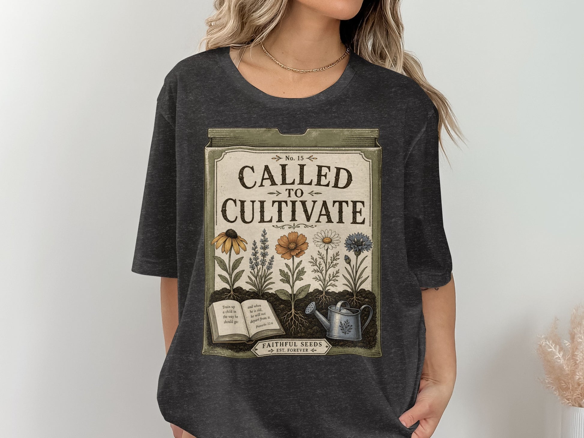 T-shirt design with "Called to Cultivate" text, flowers, an open book, and watering can.