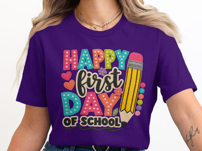 Purple t-shirt with "Happy First Day Of School" design and a yellow pencil.